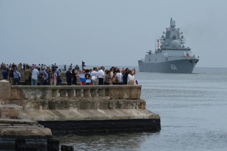 People watch Russian frigate Admiral Gorshkov as it enters Havana’s bay, Cuba, June 12, 2024. REUTERS/Alexandre Meneghini