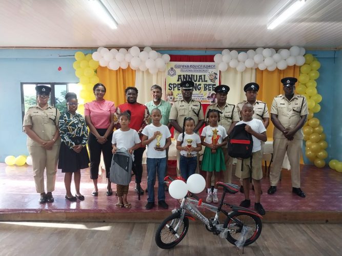 The winners pose with members of the force and others (Police photo)