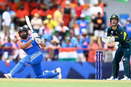 India's Rohit Sharma plays a shot for six runs as Matthew Wade of Australia keeps in their ICC T20 Cricket World Cup Super Eight match at Daren Sammy National Cricket Stadium in Gros Islet, Saint Lucia on Monday. Gareth Copley/Getty Images