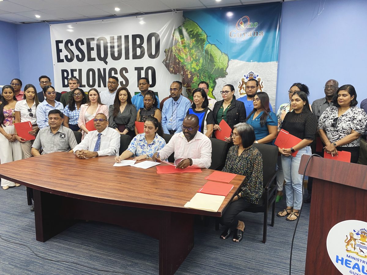 Representatives from the various medical facilities along with officials from the Ministry of Health signing the memorandum of understanding for HPV screening. 