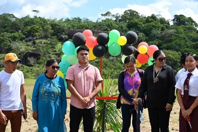 The University of
Guyana (UG) has launched a ‘branch’ in Aishalton Village, South Rupununi, according to a post on the Aishalton Village, South Rupununi Facebook page. There has been no official release from UG. In the photos above from the APA Facebook page, Vice Chancellor of UG Dr Paloma Mohamed Martin (second, right) attends a ribbon-cutting ceremony flanked by officials
and a student