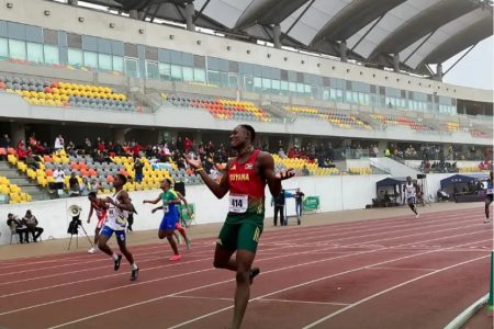 Guyana’s Malachi Austin celebrates after running 47.21s to win gold in the boys 400m event in Lima, Peru.
