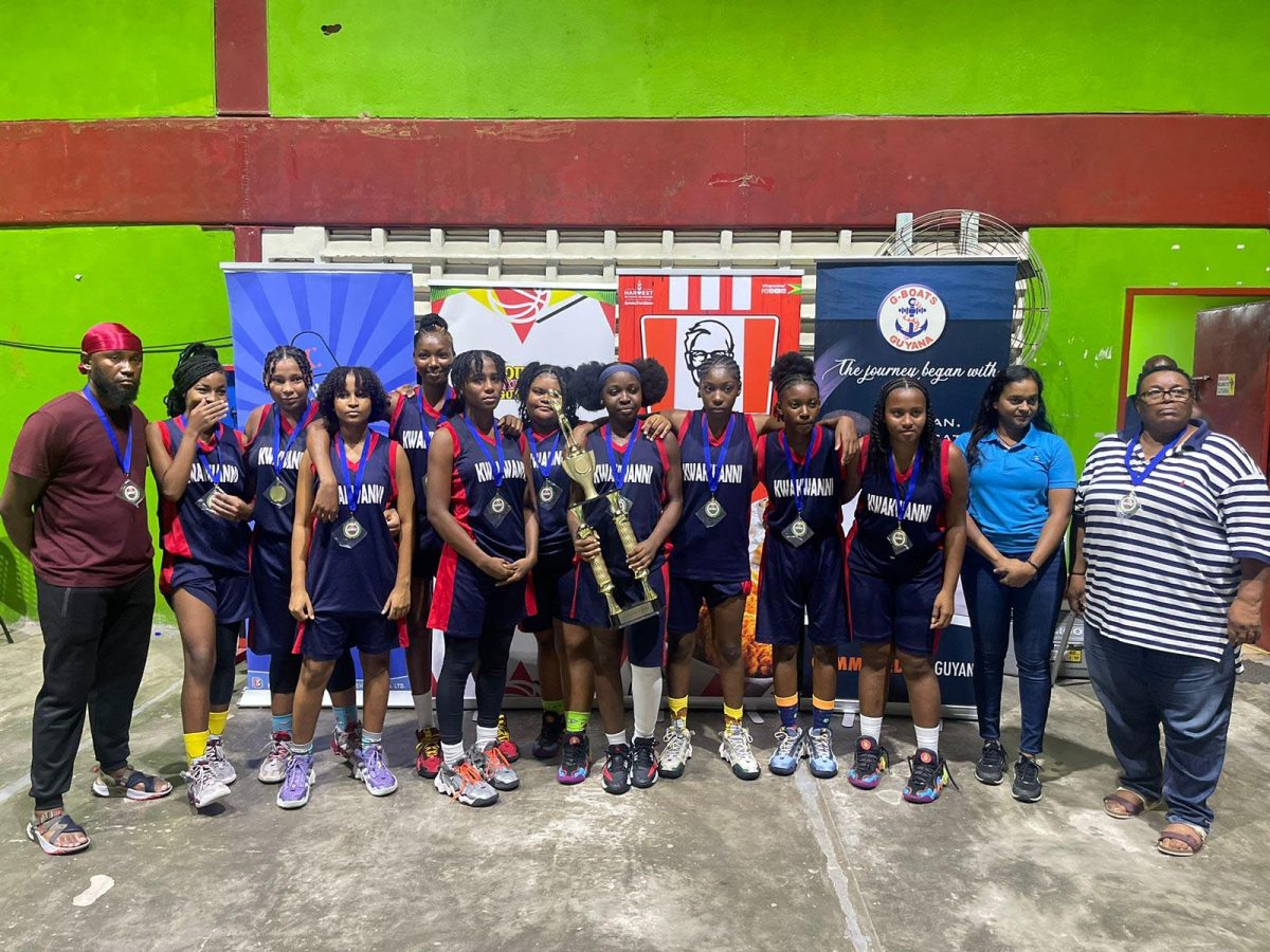 The victorious Kwakwani outfit receives the championship trophy after winning the Girl’s division