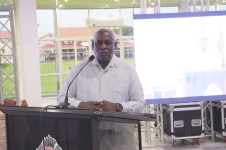 Minister Robeson Benn at the symposium 