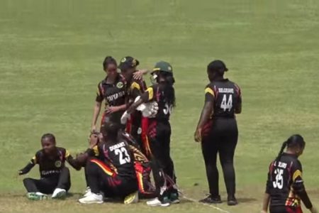 The Guyanese players celebrate following a close 2-run victory over the Leeward Islands
