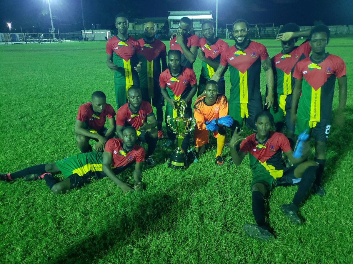 The victorious Buxton Stars outfit poses with their championship after defeating Pele in the final