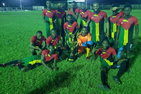 The victorious Buxton Stars outfit poses with their championship after defeating Pele in the final