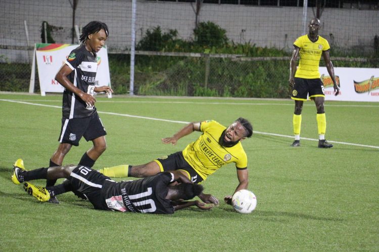 Tyric McAllister (2nd from right) on the receiving end of a crunching tackle from a Santos player