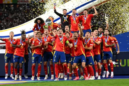 Record breakers! Spain’s captain, Alvaro Morata, hoists the 2024 European Championship in the presence of teammates after defeating England 2-1 to capture a record fourth crown.