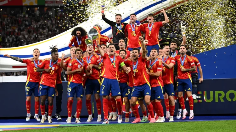 Record breakers! Spain’s captain, Alvaro Morata, hoists the 2024 European Championship in the presence of teammates after defeating England 2-1 to capture a record fourth crown.