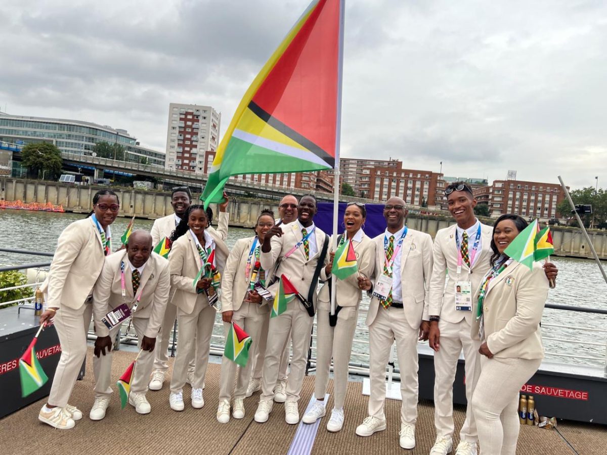 Guyana’s delegation, which also comprises members of the coaching staff, are all smiling prior to the commencement of the opening ceremony, which was conducted on the Seine River. Guyana will be represented by flagbearers Emmanuel Archibald (athletics) and Chelsea Edghill (table tennis), as well as swimmers Raekwon Noel and Aleka Persaud and athlete Aliyah Abrams.
