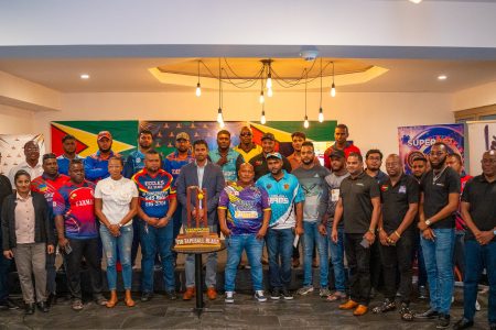 Minister of Culture, Youth, and Sport Charles Ramson Jr. (centre) posing alongside representatives of the competing teams and tournament officials at the official launch of the Kares ‘One Guyana’ T10 Tape-ball Cricket Blast
