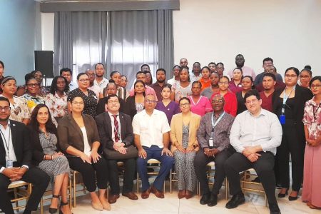 Minister of Health (centre) with members PAHO/WHO at the Flu Workshop opening ceremony  