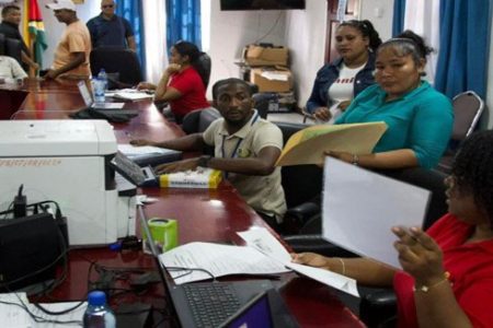 Residents being assisted during the outreach spearhead by Attorney General and Minister of Legal Affairs,  Anil Nandlall, SC, in Mabaruma yesterday. (DPI photo)
