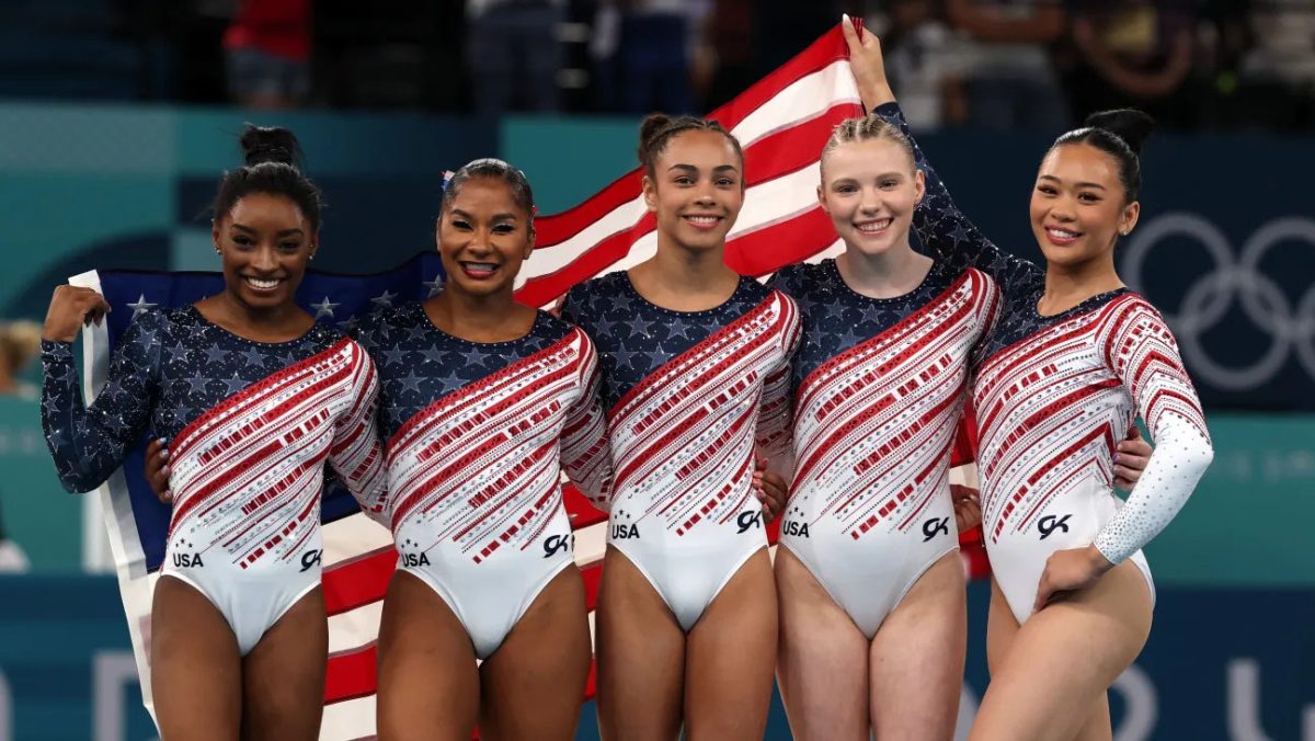 Simone Biles (left) led the US to gold in the women’s team gymnastics event