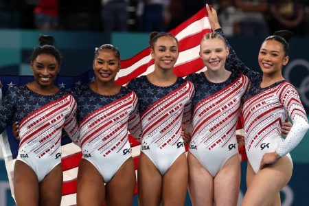 Simone Biles (left) led the US to gold in the women’s team gymnastics event