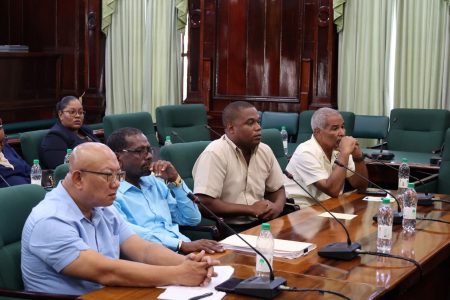 REO Kerwin Ward (second from left, front row) and the Region 7 team during the PAC meeting.