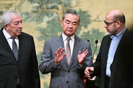 (Left to right) Fatah vice-chairman Mahmoud al-Aloul, China’s foreign minister Wang Yi, and Hamas senior member Mussa Abu Marzuk attend an event in Beijing. (AFP pic)