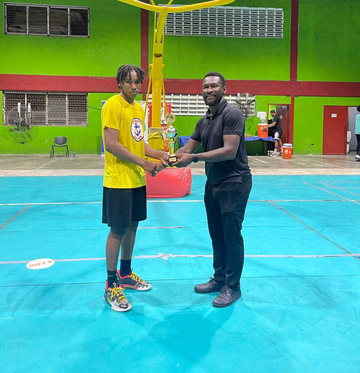 Cordel Hoyte (left) captured the MVP accolade in the boy’s U-18 division after powering his side to victory