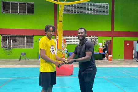 Cordel Hoyte (left) captured the MVP accolade in the boy’s U-18 division after powering his side to victory