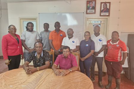 GWI CEO Shaik Baksh (seated at right) with stakeholders of the Kwakwani Utilities Incorporated (GWI photo)