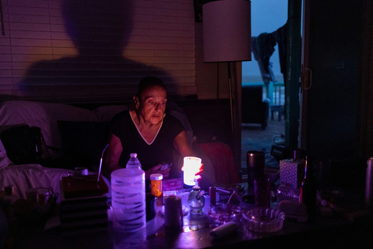 FILE PHOTO: Marguerite Thomas lights candles at dusk after losing electricity due to Hurricane Beryl in Surfside Beach, Texas, U.S., July 9, 2024.  REUTERS/Adrees Latif/File Photo