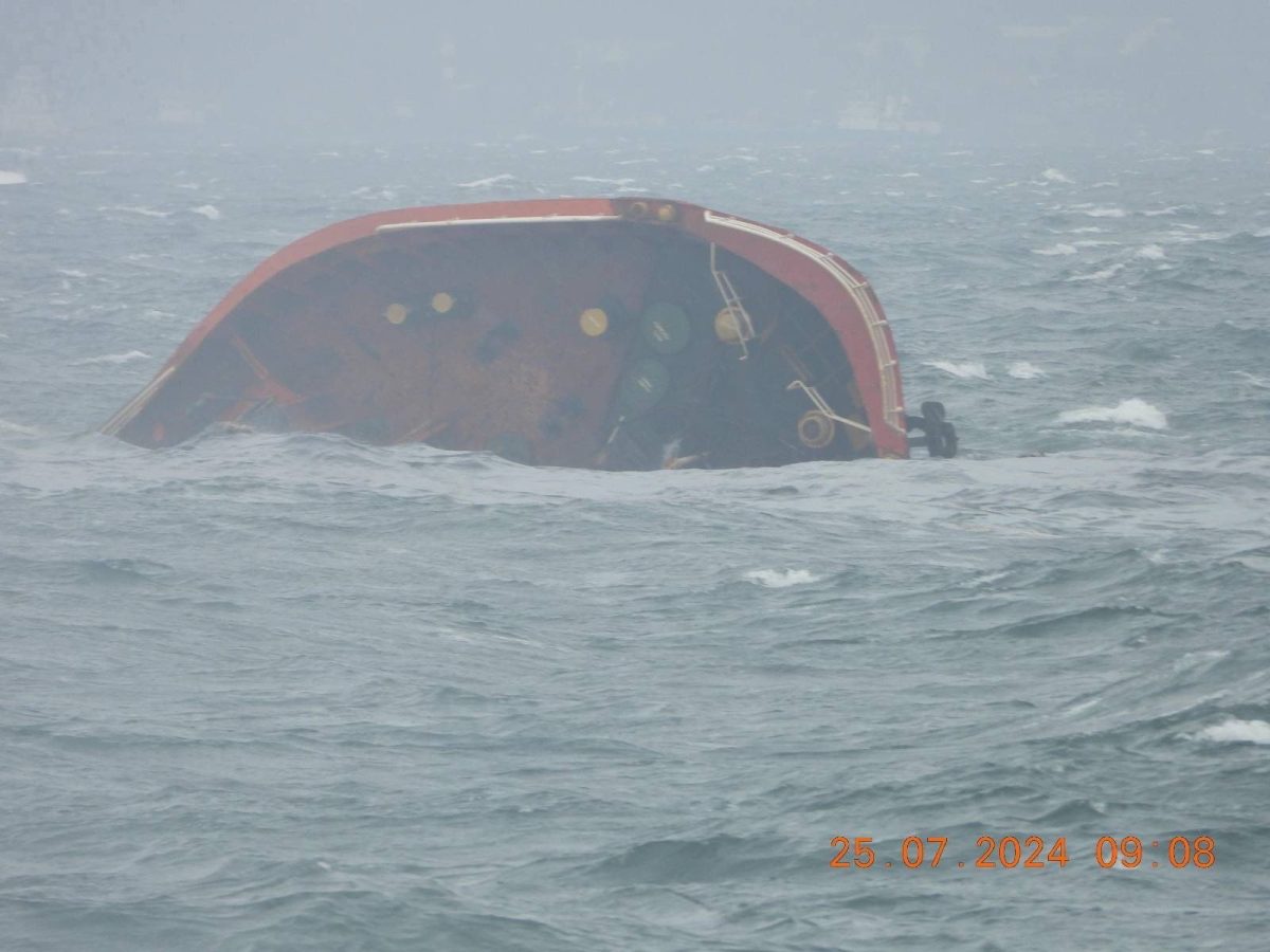 A handout photo released by the Philippine Coast Guard shows the tip of MT Terra Nova protruding in Manila Bay, Philippines, July 25, 2024. Philippine Coast Guard/Handout via REUTERS