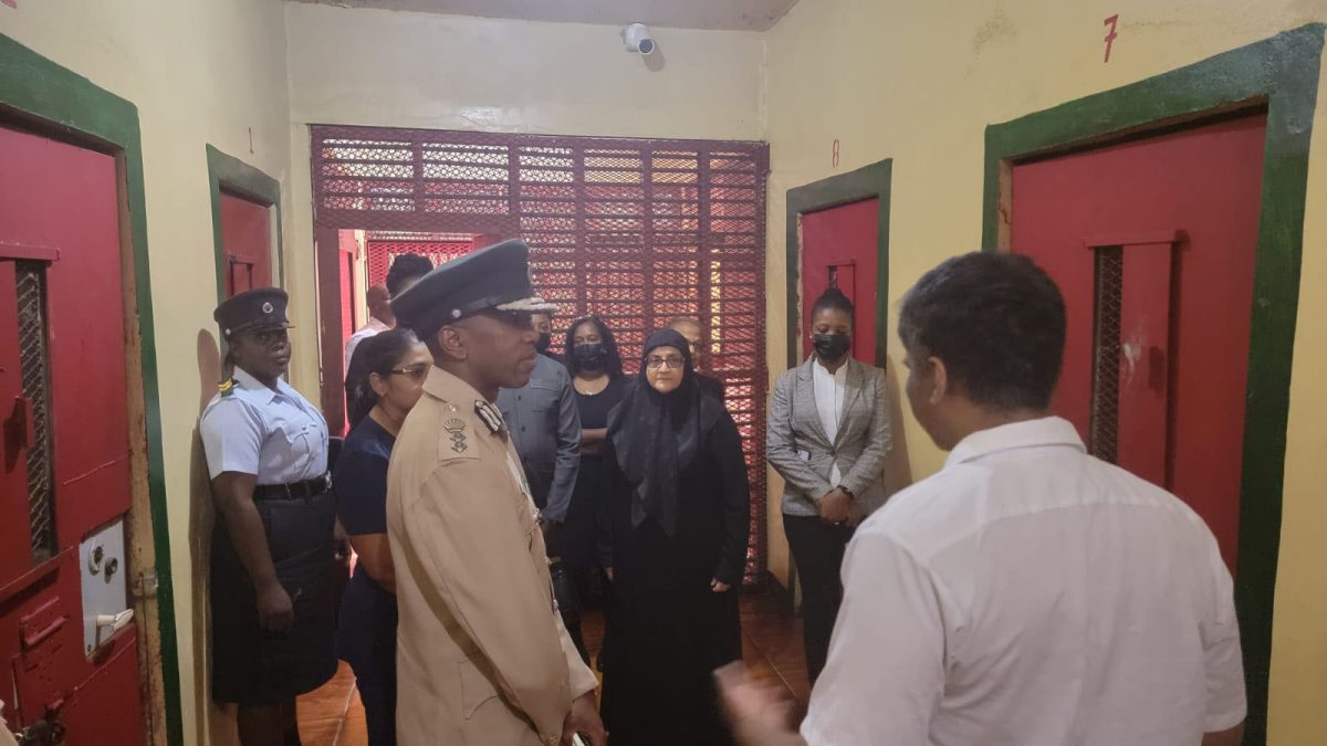 Director of Public Prosecutions Shalimar Ali-Hack SC (centre) in the background during the visit.  (GPS photo)