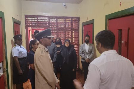 Director of Public Prosecutions Shalimar Ali-Hack SC (centre) in the background during the visit.  (GPS photo)