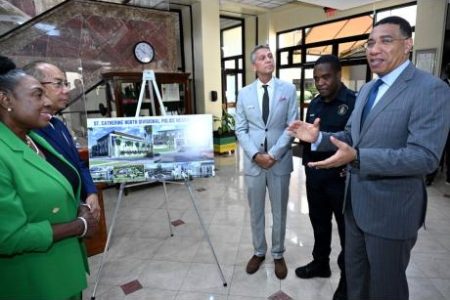 Prime Minister Andrew Holness (right) speaks with (from left) Olivia Grange, minister of culture, gender, entertainment and sport and member of parliament for St Catherine Central; Dr Horace Chang, deputy prime minister and minister of national security; Peter Melhado, chairman of West Indies Home Contractors Limited; and Dr Kevin Blake, commissioner of police, during the signing of the contract for the Ministry of National Security's construction of the St Catherine North Police Divisional Headquarters at Jamaica House in St Andrew on Tuesday.