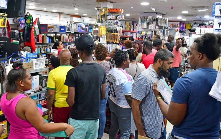 FILE PHOTO: People shop for supplies in a supermarket ahead of the arrival of Hurricane Beryl in Bridgetown, Barbados June 30, 2024.  REUTERS/Nigel R Browne/File Photo