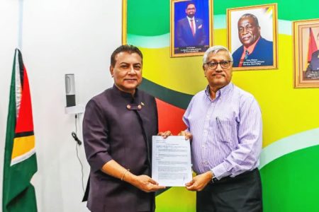 Head of the Guyana Office for Investment, Dr Peter Ramsaroop (left) with  Chief Executive Officer of Demerara Distillers Limited (DDL), Komal Samaroo. (Department of Public Information photo)