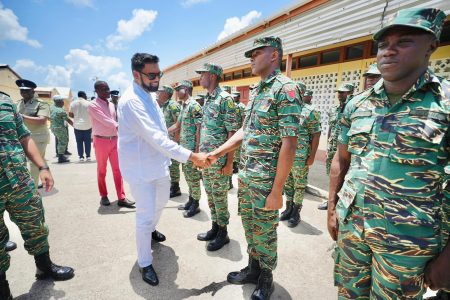 Meeting ranks: Commander-in-Chief of the Armed Forces, President Irfaan Ali, who is Grenada for the 47th Regular Meeting of the Conference of Heads of Government of CARICOM, yesterday met with Guyana Defence Force troops deployed there to assist with the rebuilding efforts following the destruction of Hurricane Beryl. Ali was accompanied by Grenadian Prime Minister Dickon Mitchell. (Office of the President photo)