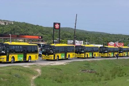 The new Jamaica Urban Transit Company (JUTC) buses arrive at the Portmore Depot in St. Catherine today, after being cleared at Kingston Wharves. A total of 100 compressed natural gas (CNG) buses were acquired by the Government to strengthen the JUTC fleet. - Contributed photo