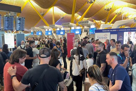 Passengers wait at Barajas Airport, as Spanish airport operator Aena on Friday reported a computer systems "incident" at all Spanish airports which may cause flight delays, in Madrid, Spain July 19, 2024. REUTERS/Elena Rodriguez