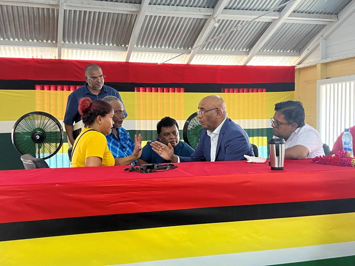 The mother of the two children (left) in discussion with Vice President Bharrat Jagdeo
