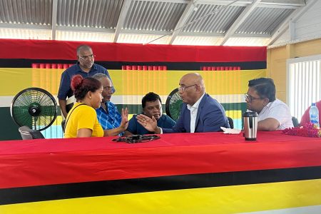 The mother of the two children (left) in discussion with Vice President Bharrat Jagdeo
