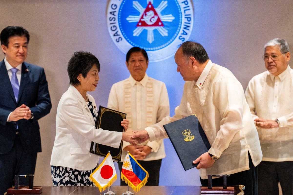 Japan’s Foreign Minister Yoko Kamikawa and Philippine’s Defence Minister Gilberto Teodoro shake hands after signing the reciprocal access agreement, at the Malacanang Palace in Manila, Philippines, July 8, 2024. REUTERS/Lisa Marie David