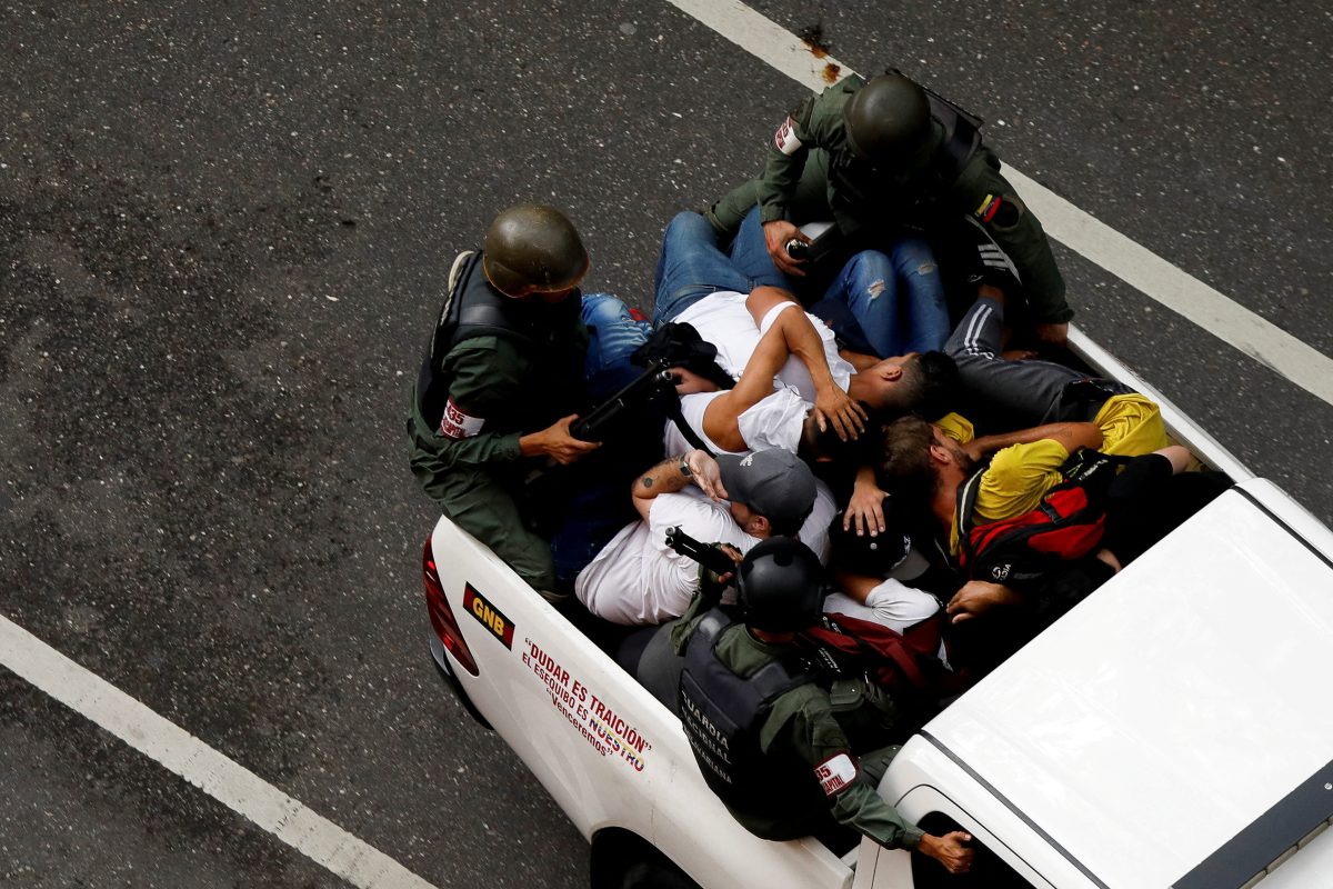 Bolivarian National Guard detain demonstrators as people gather to protest election results that awarded Venezuela’s President Nicolas Maduro with a third term, in Caracas, Venezuela July 30, 2024. REUTERS/Leonardo Fernandez Viloria