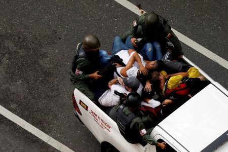 Bolivarian National Guard detain demonstrators as people gather to protest election results that awarded Venezuela's President Nicolas Maduro with a third term, in Caracas, Venezuela July 30, 2024. REUTERS/Leonardo Fernandez Viloria