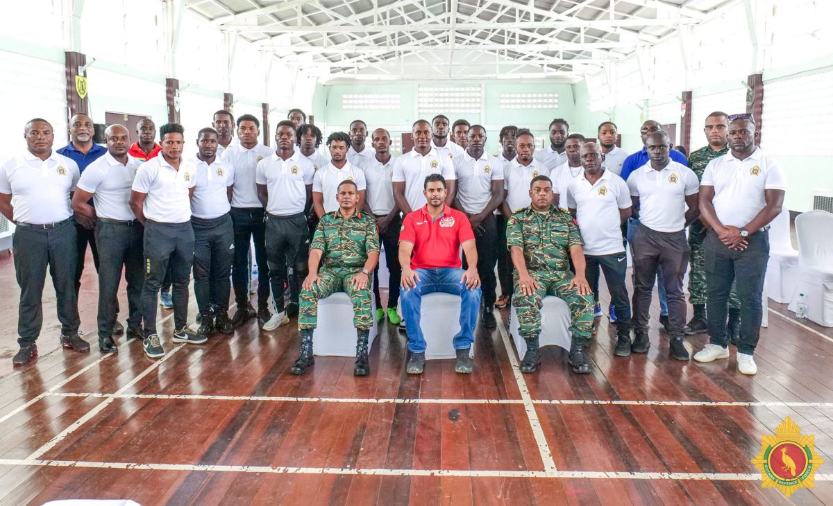 Minister of Culture, Youth and Sport,  Charles S. Ramson with GDF officials and the football club members