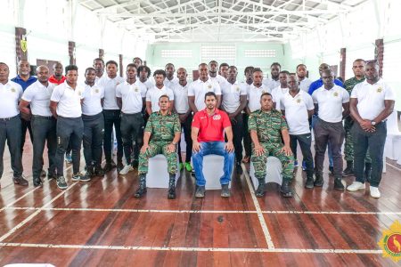 Minister of Culture, Youth and Sport,  Charles S. Ramson with GDF officials and the football club members