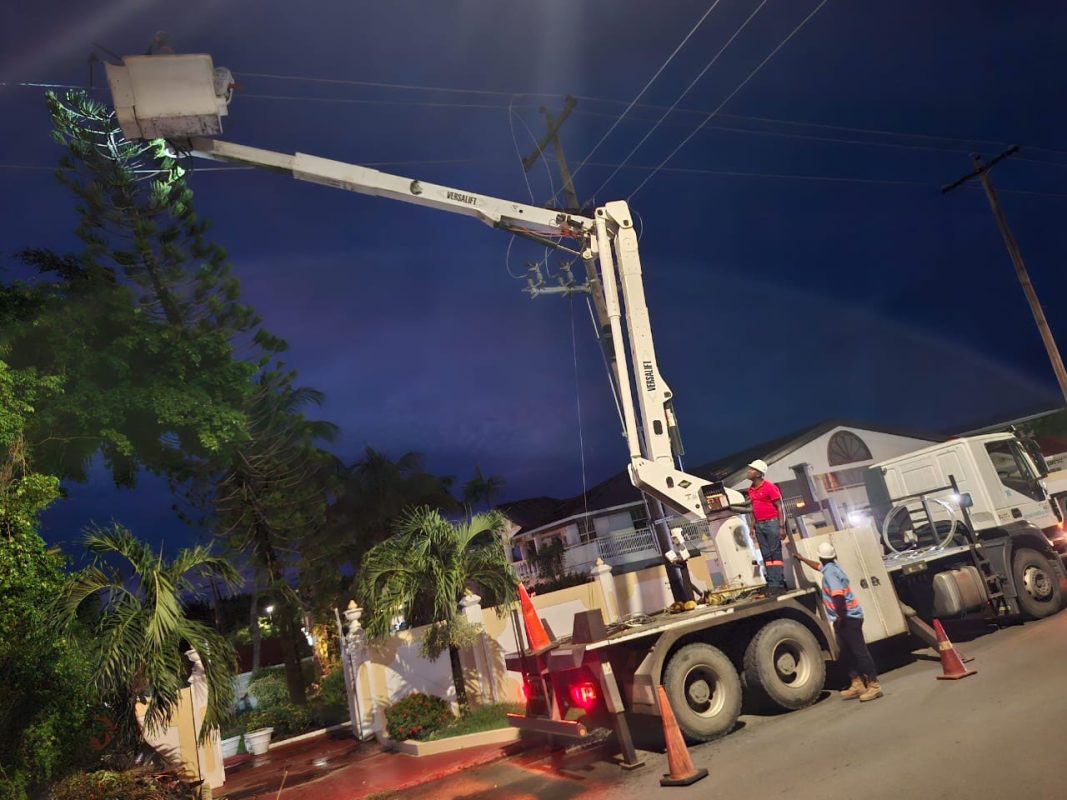  A pine tree fell on power lines yesterday cutting electricity to customers between  Better Hope to Success, East Coast Demerara. This GPL photo shows a crew working last night to restore power.