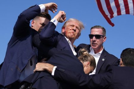 Republican U.S. presidential candidate, former President Donald Trump is surrounded by U.S. Secret Service agents at a campaign rally yesterday in Butler, Pa after a shooting. (Evan Vucci/AP Photo