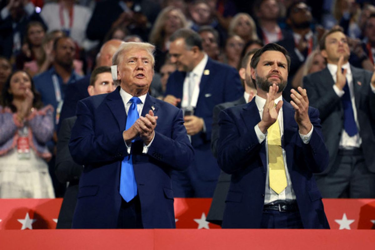 Republican presidential candidate Donald Trump and his vice presidential running mate, Sen. J.D. Vance, applaud speakers on the second day of the Republican National Convention at the Fiserv Forum on July 16, 2024 in Milwaukee, Wisconsin. (Getty Images/AFP)