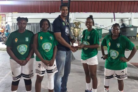 The victorious Kwakwani Untouchables unit receiving their accolade from GBF Vice-President Jermaine Slater after besting Lady Trojans in the final