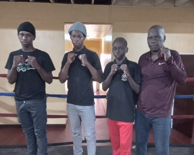 Some of the members of the Guyana team that departed local shores to compete at the Ronald Wilson Memorial Boxing Championship in Barbados. From left to right are boxers Shemroy Wintz, Shaquain James, and Keyon Britton. Also in the photo is coach Steel Crawford.