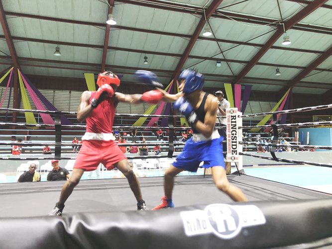 Action between Antonio Stephens (red) of Guyana and Jaquan Grant of Barbados in the Junior 66Kg category
