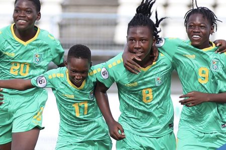 Several members of the Golden Jaguars celebrate after scoring
against the Cayman Islands in the CFU Boy’s U-14 Challenge Series