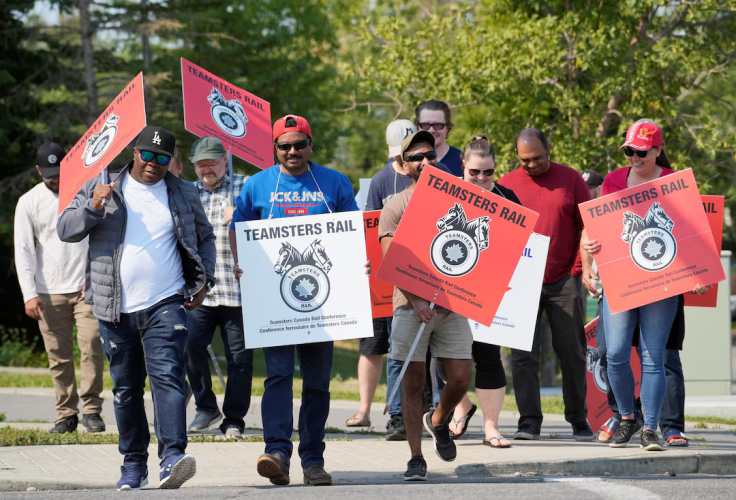 Teamsters union workers picket Canadian Pacific Kansas City (CPKC) headquarters after being locked out by the company in Calgary, Alberta, Canada, August 23, 2024.